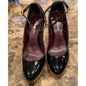 Beautiful black BCBG patent leather stiletto heels.